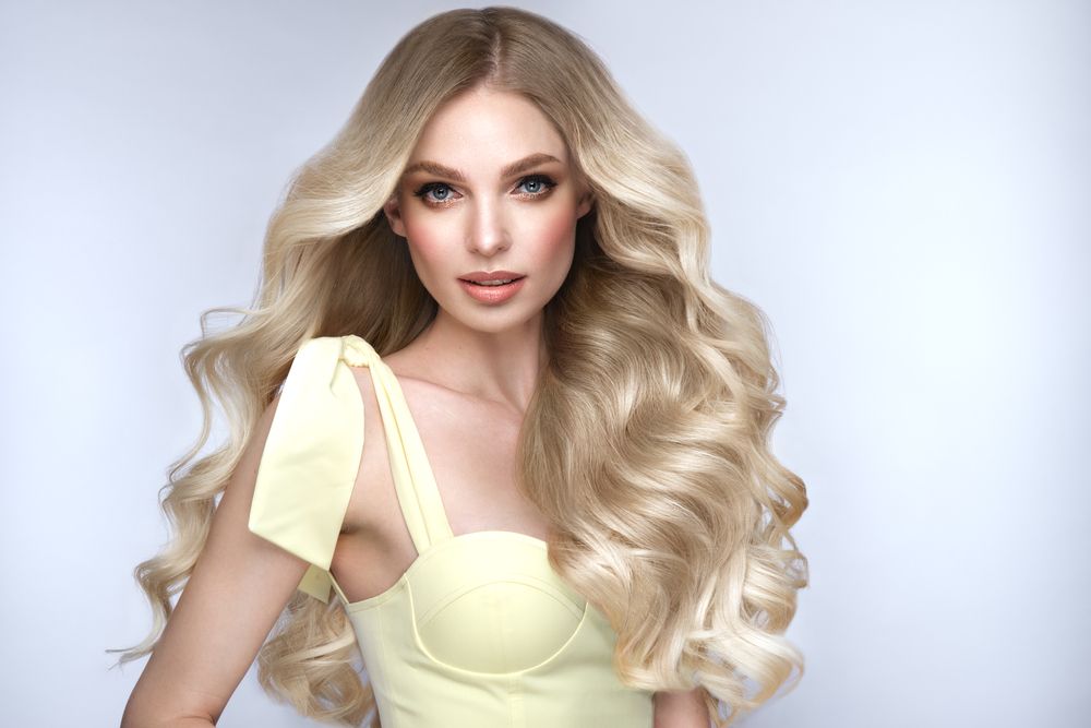 portrait-woman-wavy-blonde-hair-yellow-dress.jpg
